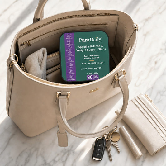 PuraDaily Appetite Balance and Weight Support Strips tin tucked inside a beige handbag with keys and wallet