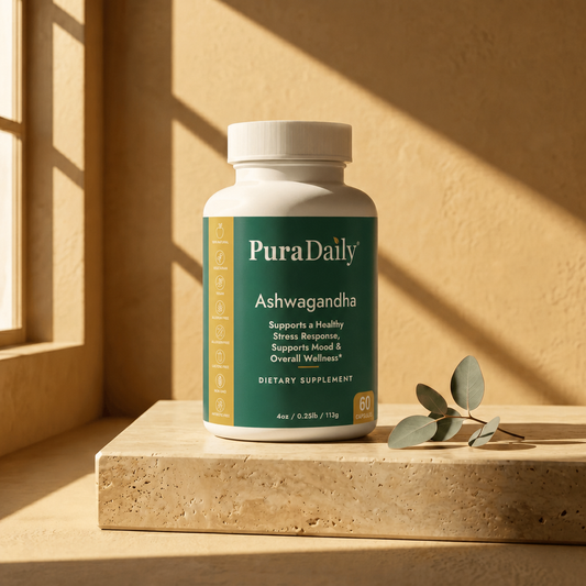 PuraDaily Ashwagandha supplement bottle on a wooden surface with a warm background